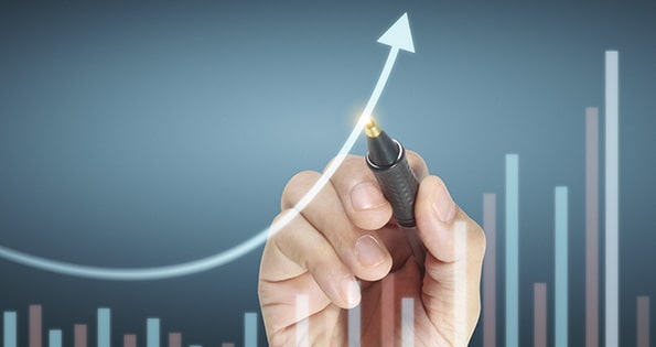 A bar graph with a hand drawn upward trend.